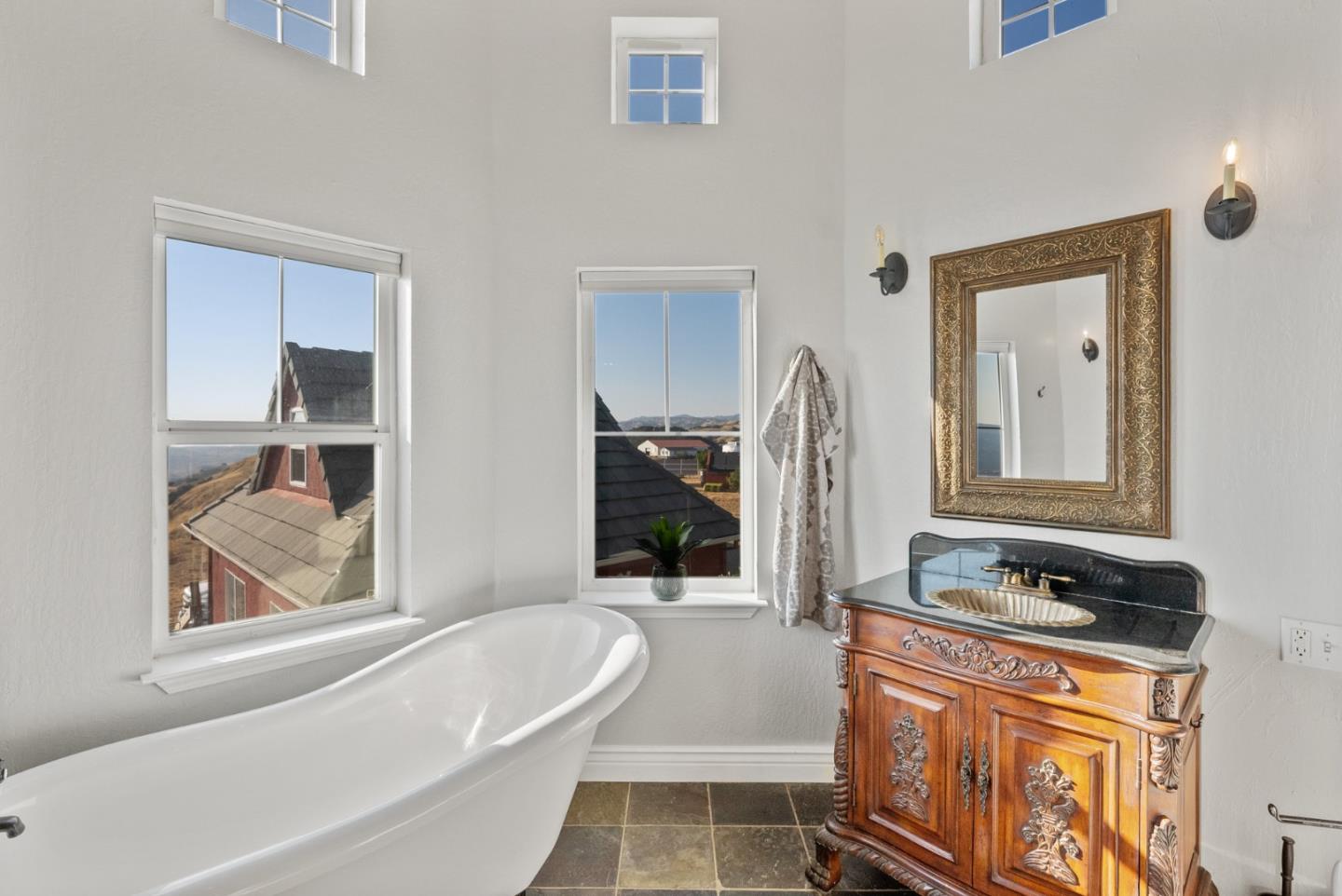 16650 Finley Ridge Road Morgan Hill, CA 95037 - Photo 43 of 85 a bathroom with a granite countertop tub sink and mirror