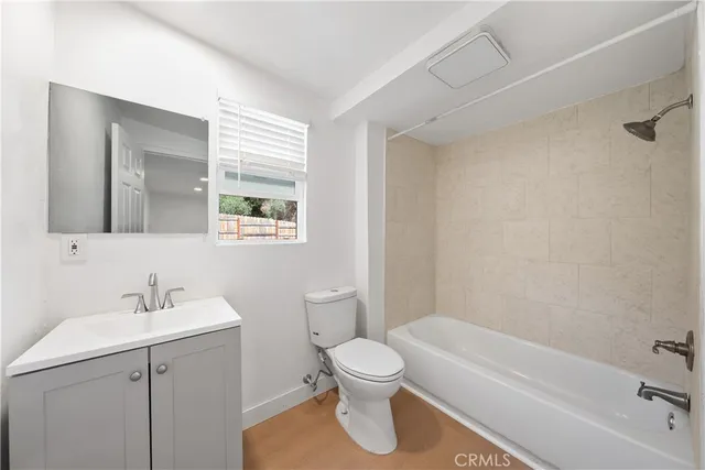 a bathroom with a toilet a sink and a bathtub