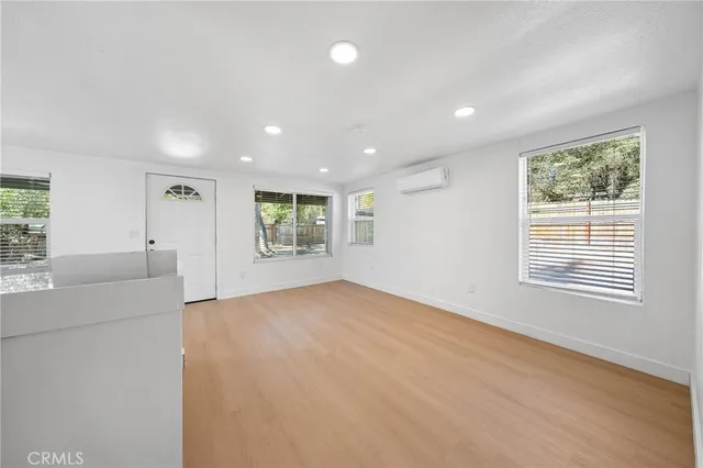 a view of an empty room with a window