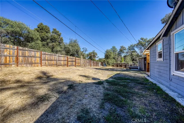 a view of backyard with green space