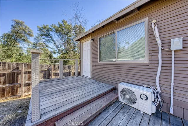 a view of a wooden deck with a table and chairs