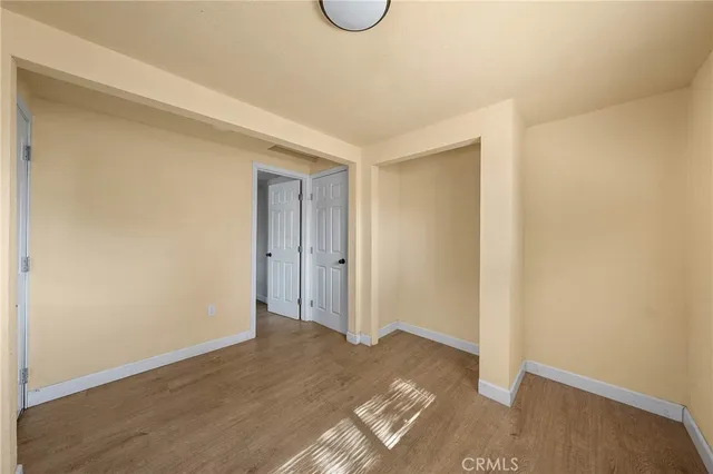 a bathroom with a sink and mirror with bathtub