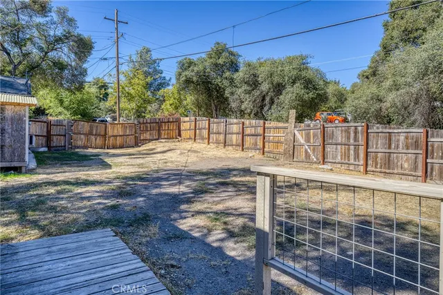 a view of outdoor space with wooden deck