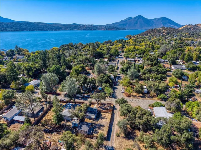 an aerial view of residential house and sandy dunes
