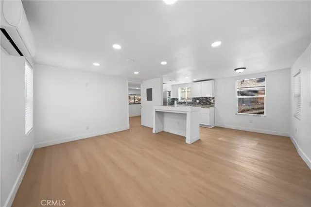 a view of a kitchen with wooden floor