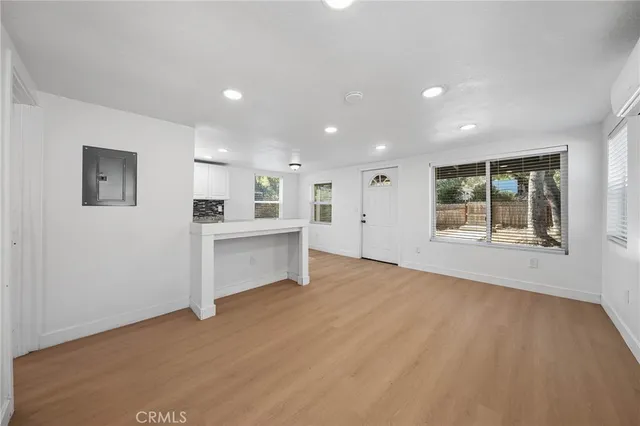 a view of an empty room with a window