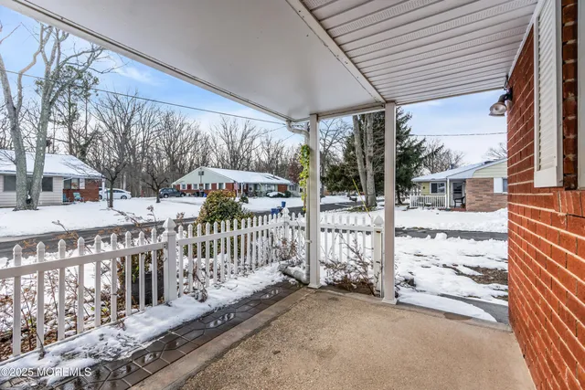 a view of a house with wooden fence