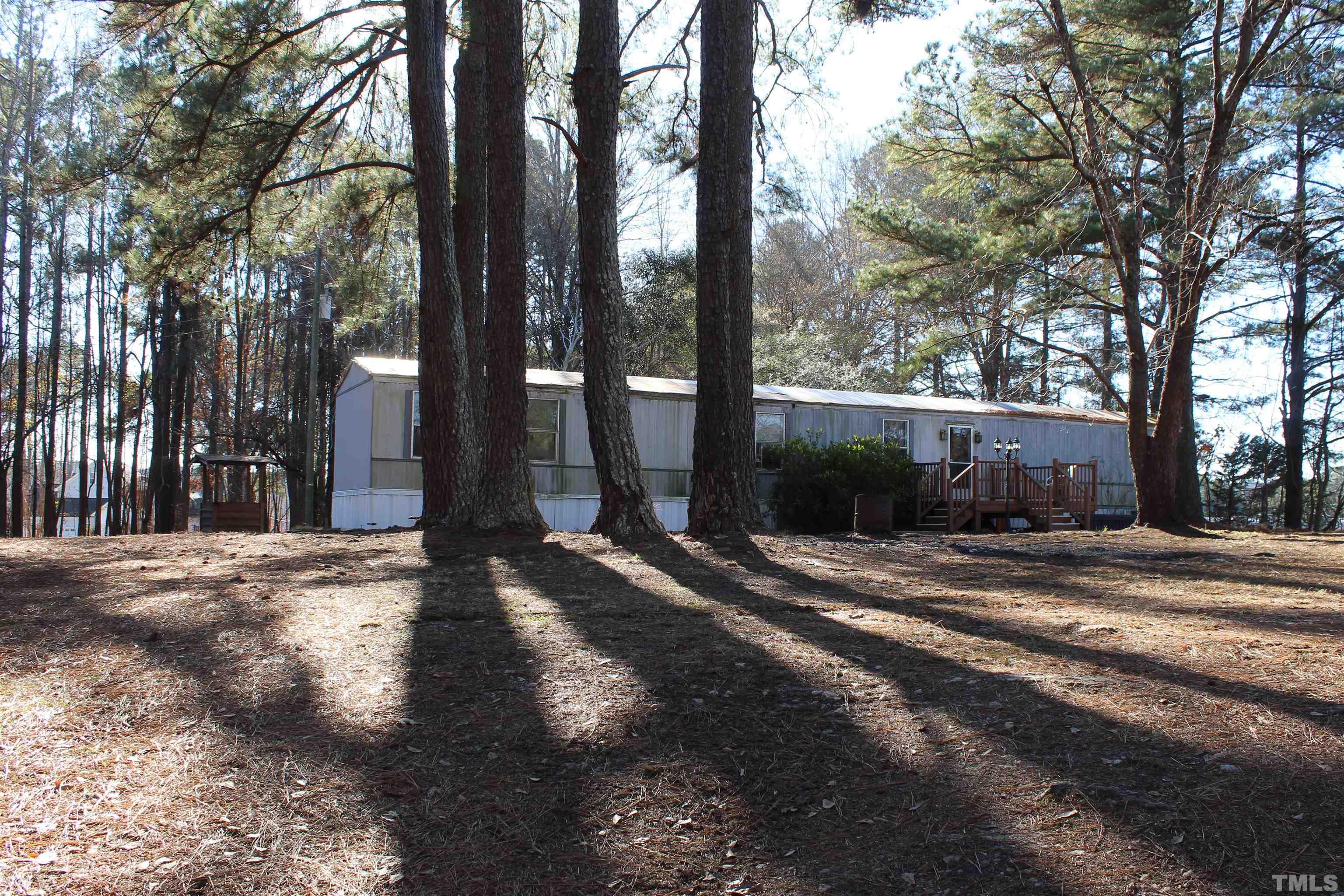 3617 Banks Road Raleigh, NC 27603 - Photo 3 of 37 a view of a street with large trees