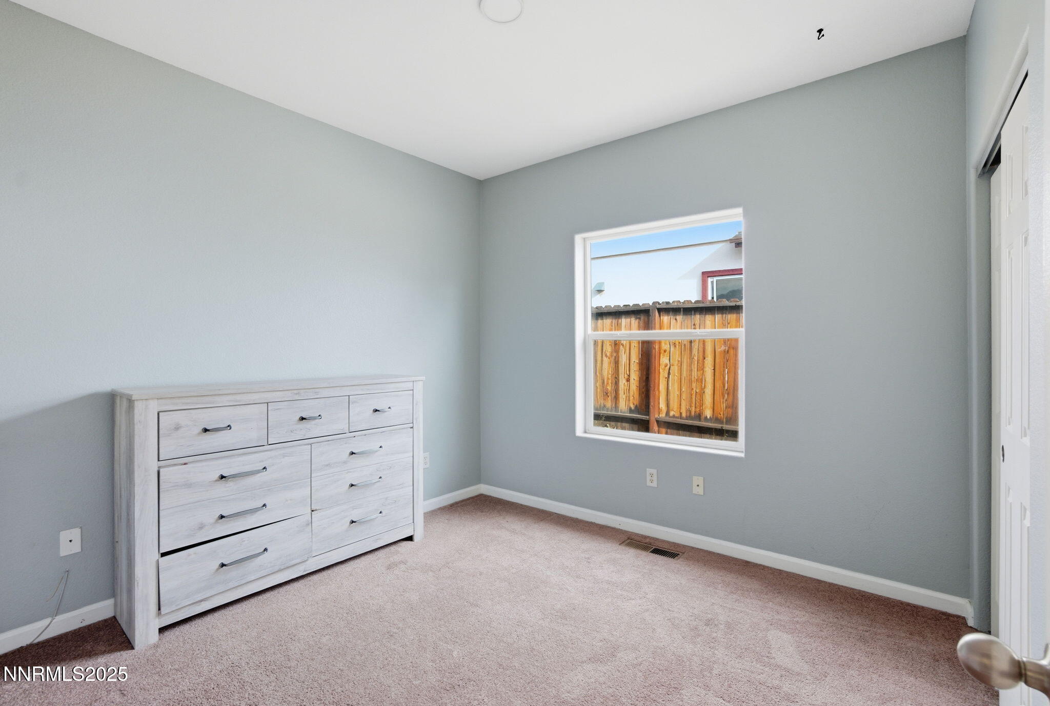 365 Orrcrest Drive Reno, NV 89506 - Photo 14 of 21 an empty room with windows and closet