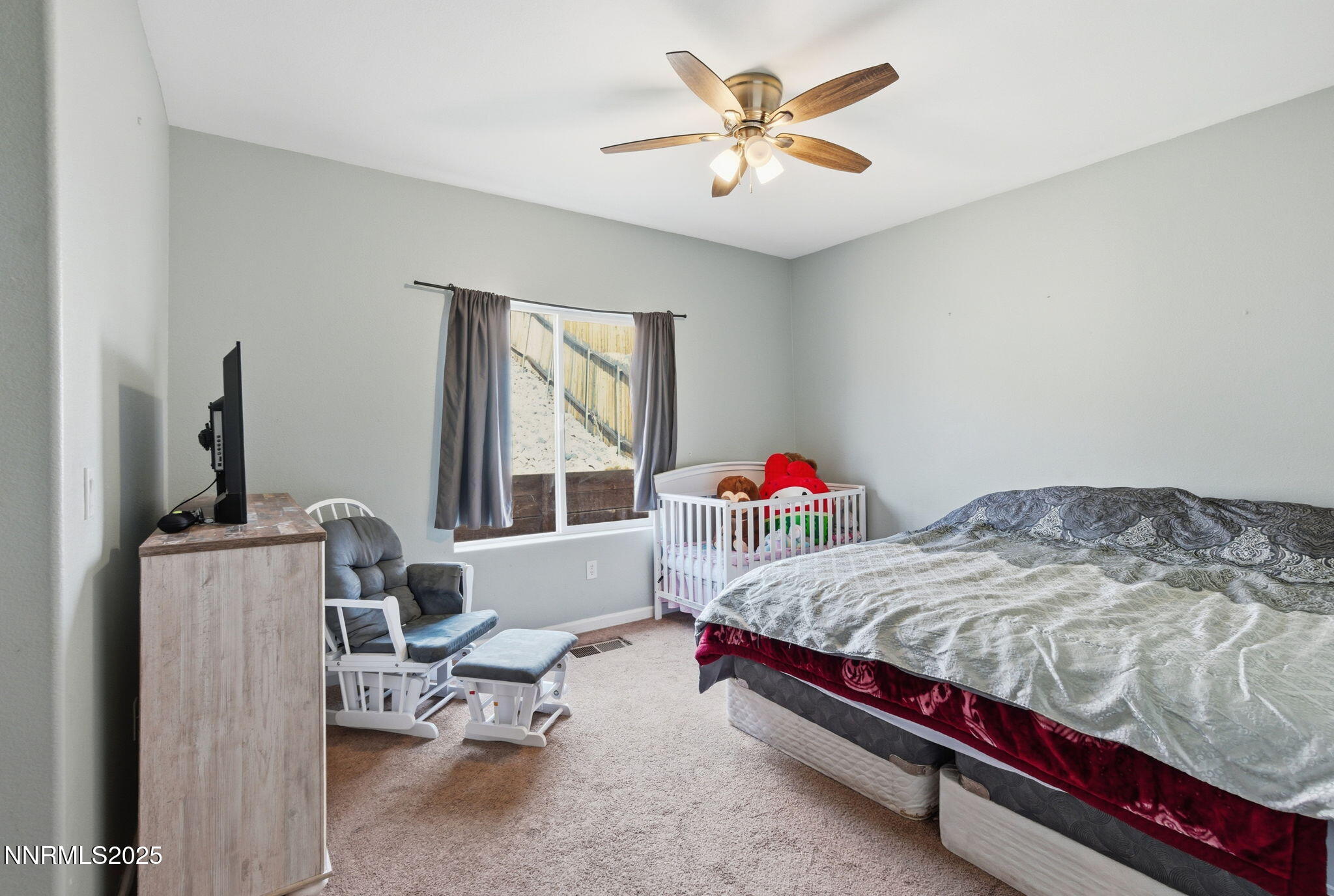 365 Orrcrest Drive Reno, NV 89506 - Photo 16 of 21 a bedroom with a bed a couch and a window