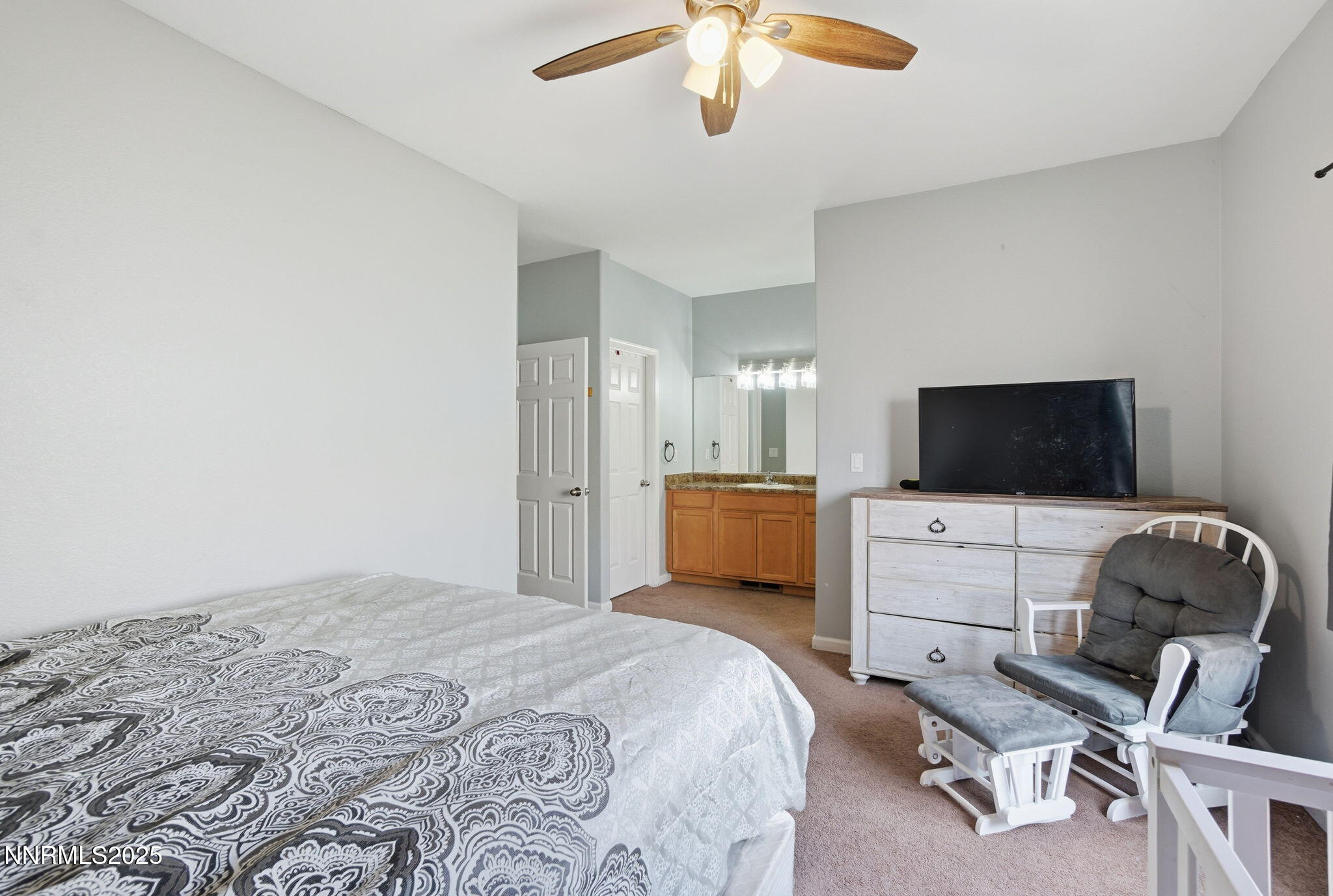365 Orrcrest Drive Reno, NV 89506 - Photo 17 of 21 a bedroom with a bed and a chair