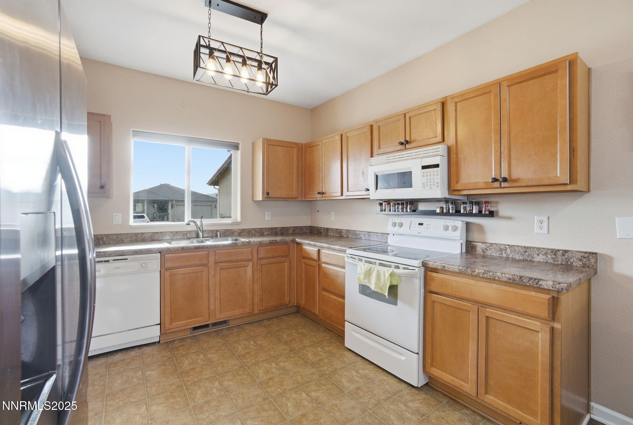 365 Orrcrest Drive Reno, NV 89506 - Photo 9 of 21 a kitchen with stainless steel appliances granite countertop a sink stove and cabinets