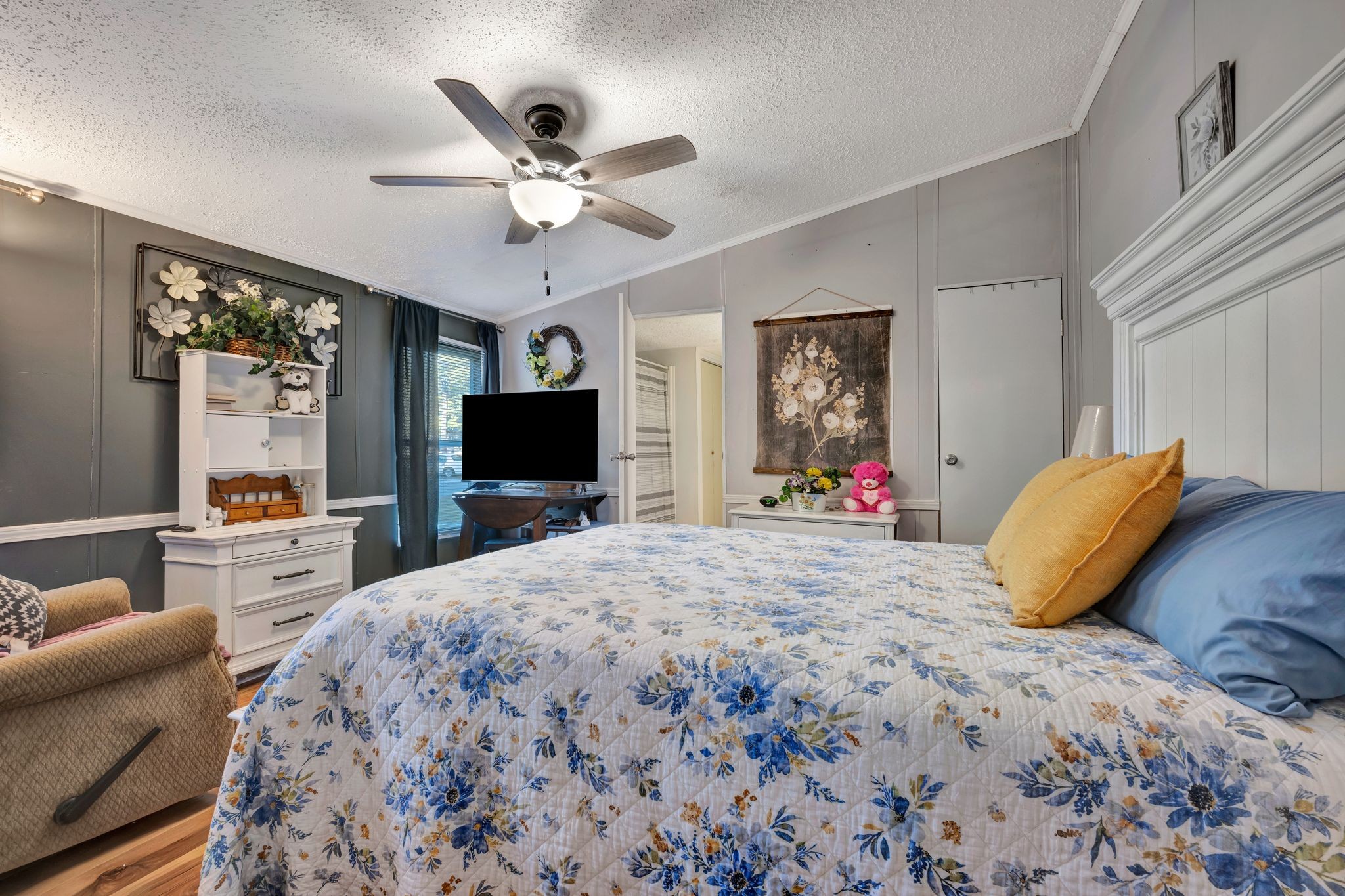 944 Deason Road Dickson, TN 37055 - Photo 16 of 28 a bedroom with a bed and a flat screen tv