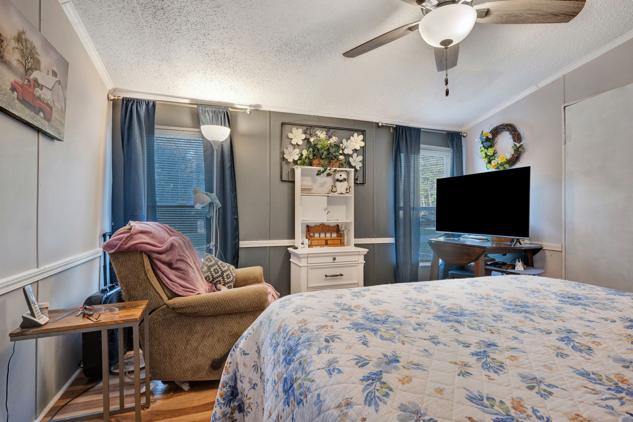 944 Deason Road Dickson, TN 37055 - Photo 17 of 28 a bedroom with furniture and a flat screen tv