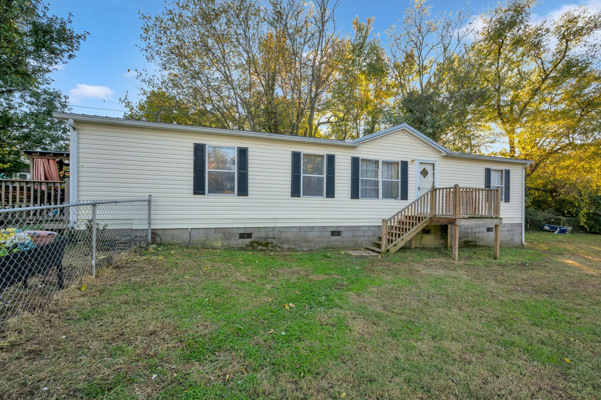 944 Deason Road Dickson, TN 37055 - Photo 2 of 28 a backyard of a house with table and chairs
