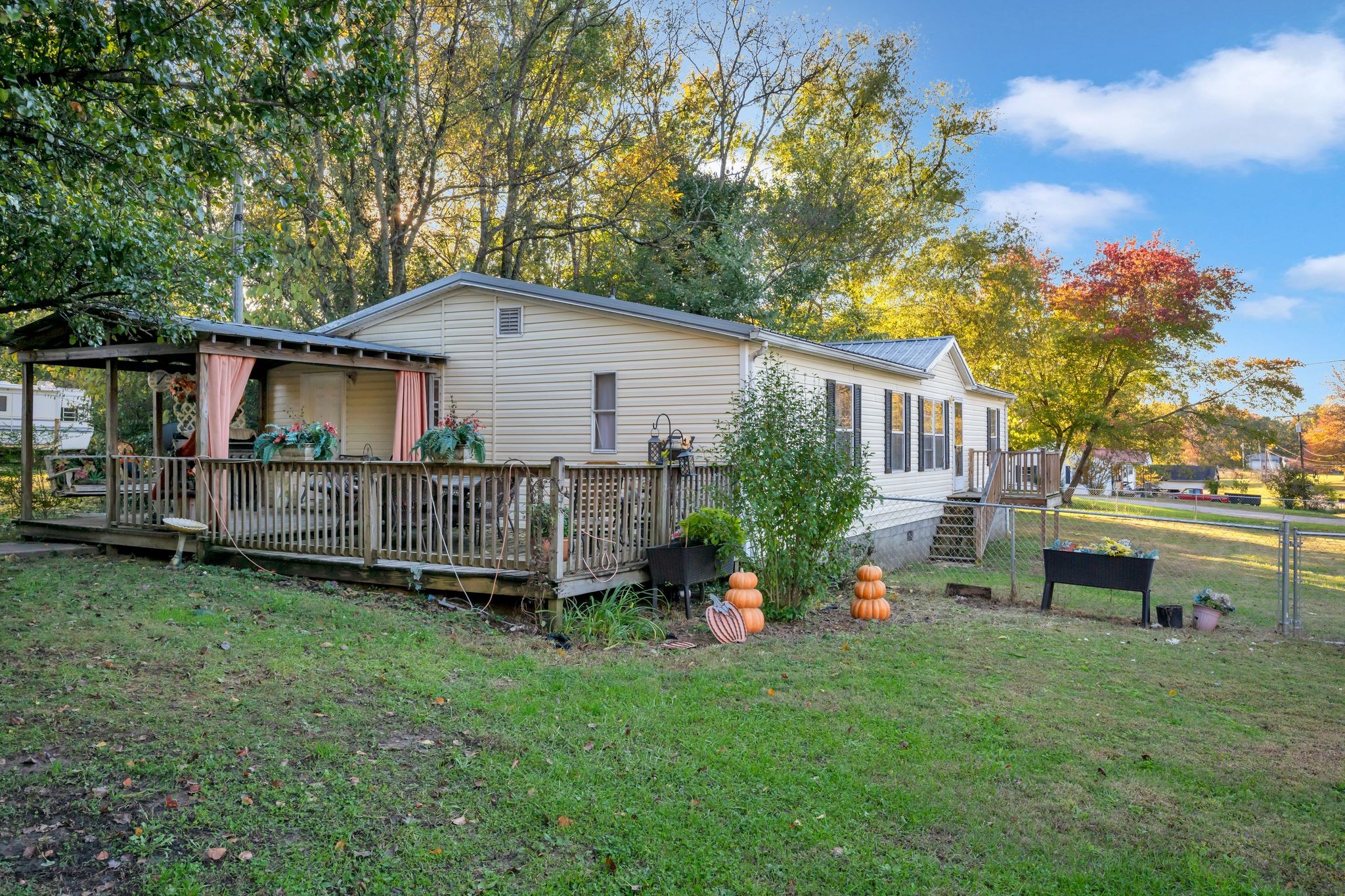 944 Deason Road Dickson, TN 37055 - Photo 3 of 28 a backyard of a house with barbeque oven table and chairs