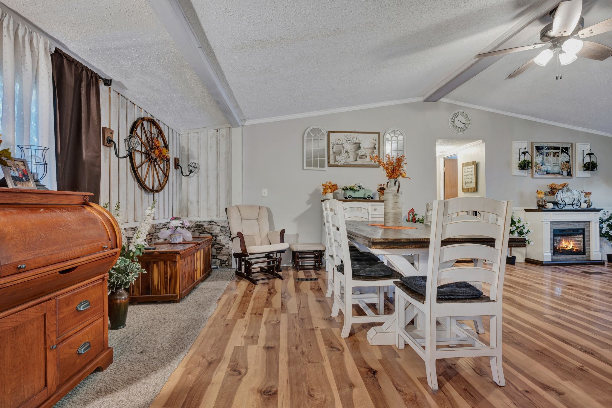 944 Deason Road Dickson, TN 37055 - Photo 10 of 28 a view of a livingroom with furniture a dinning area hardwood floor and a ceiling fan
