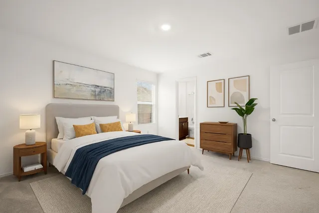 a kitchen with granite countertop a sink stove and refrigerator