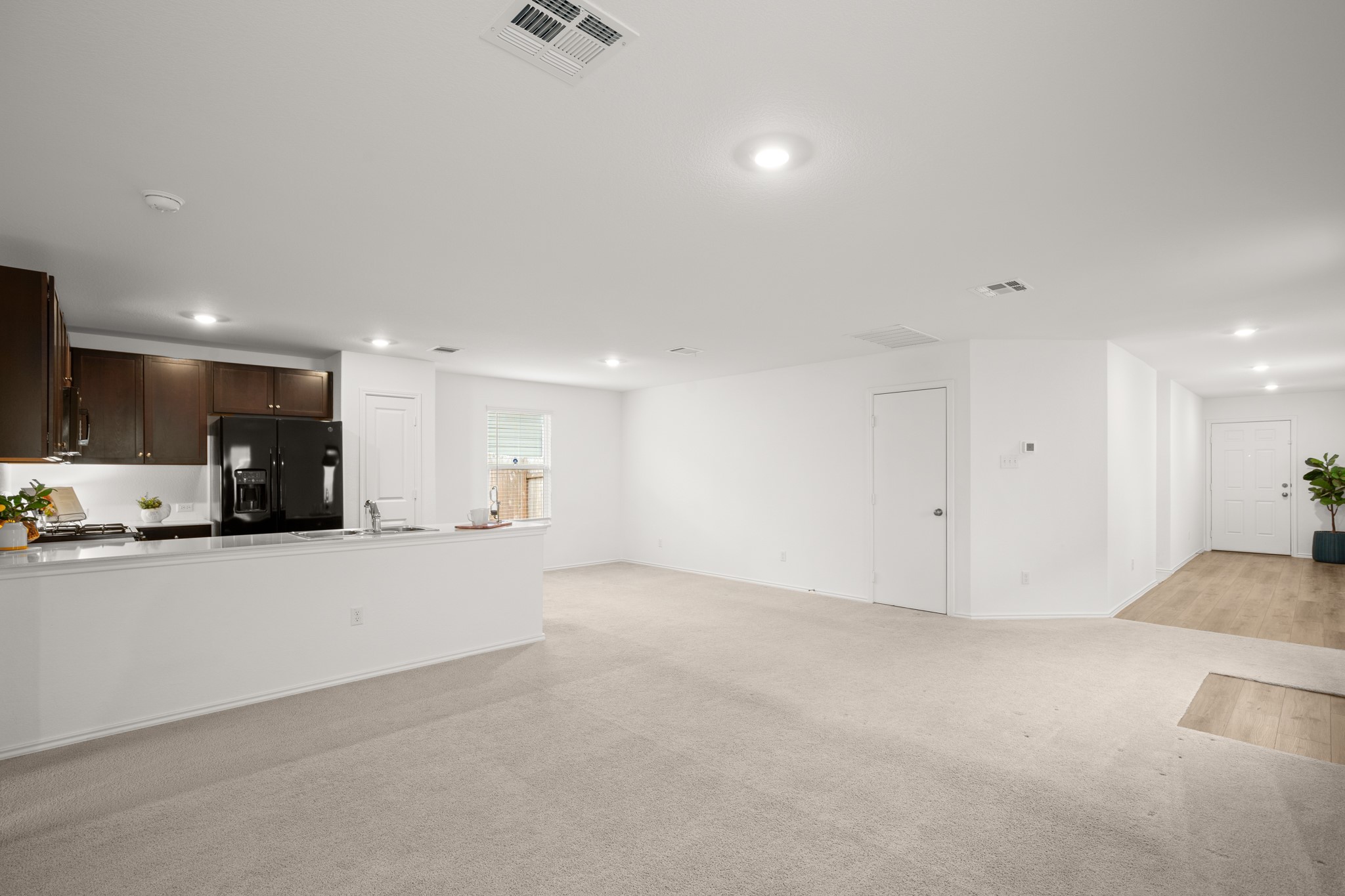 125 Gabbro Gardens Maxwell, TX 78656 - Photo 9 of 24 Easily stay connected throughout the main living area with this desirable open concept layout.