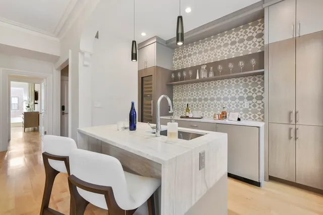 a kitchen with stainless steel appliances a sink stove and refrigerator