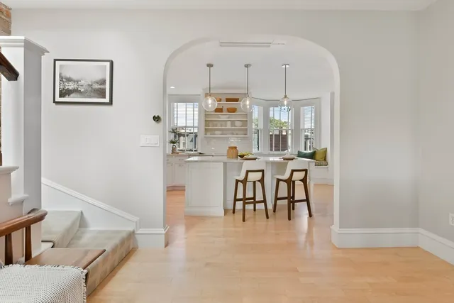 a dining room with furniture and a chandelier