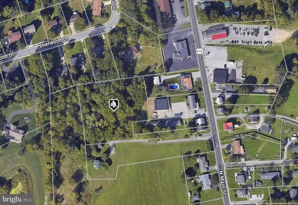 a bathroom with a white tub shower and sink