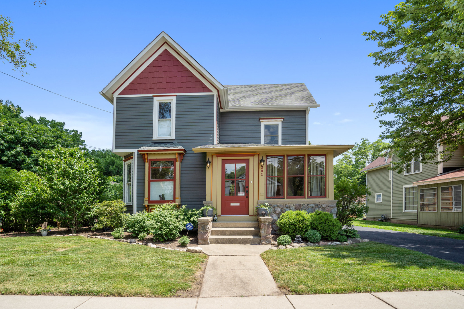 201 Spring Street Cary, IL 60013 - Photo 1 of 34 a front view of a house with garden