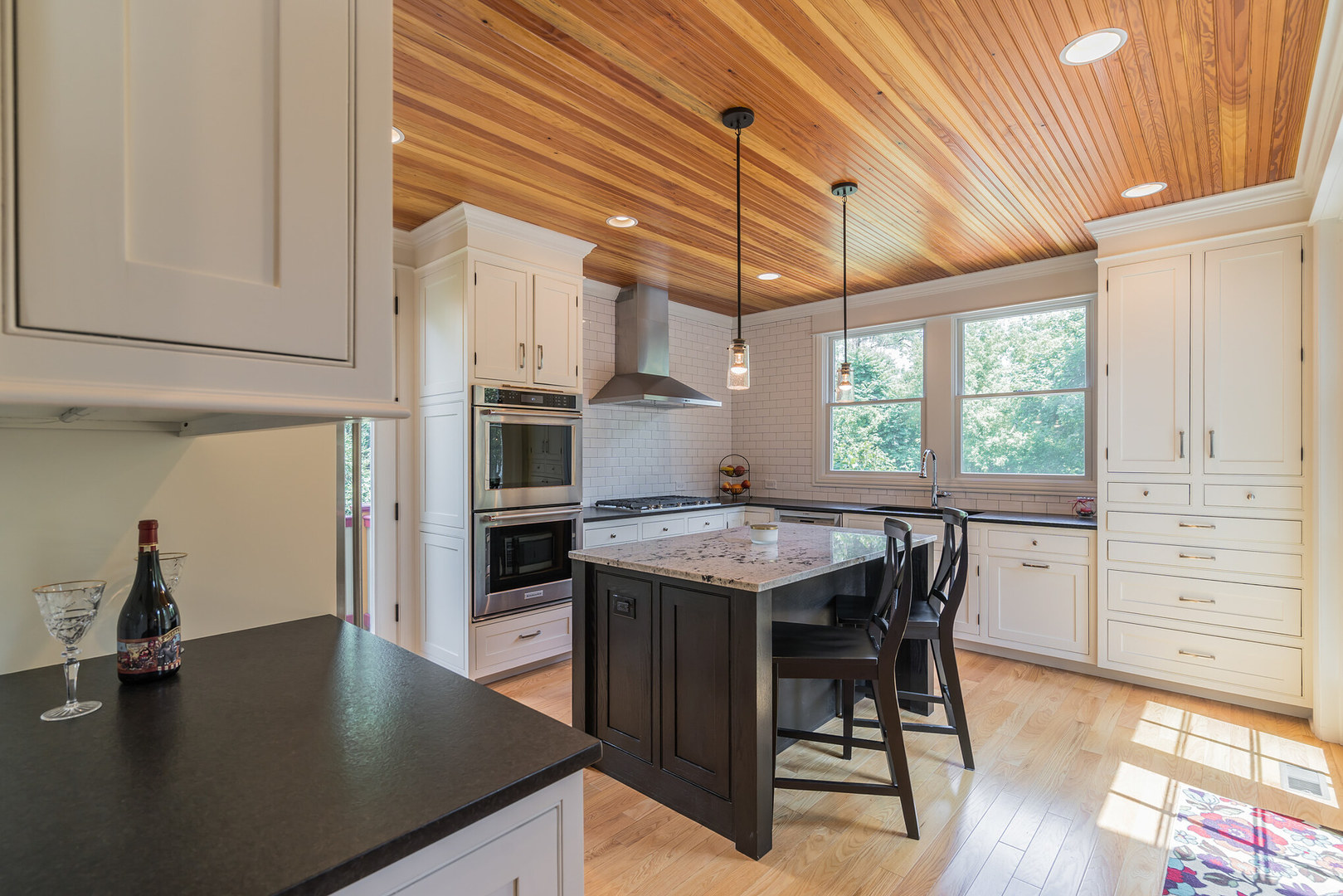 201 Spring Street Cary, IL 60013 - Photo 11 of 34 a kitchen with a table chairs and wooden floor