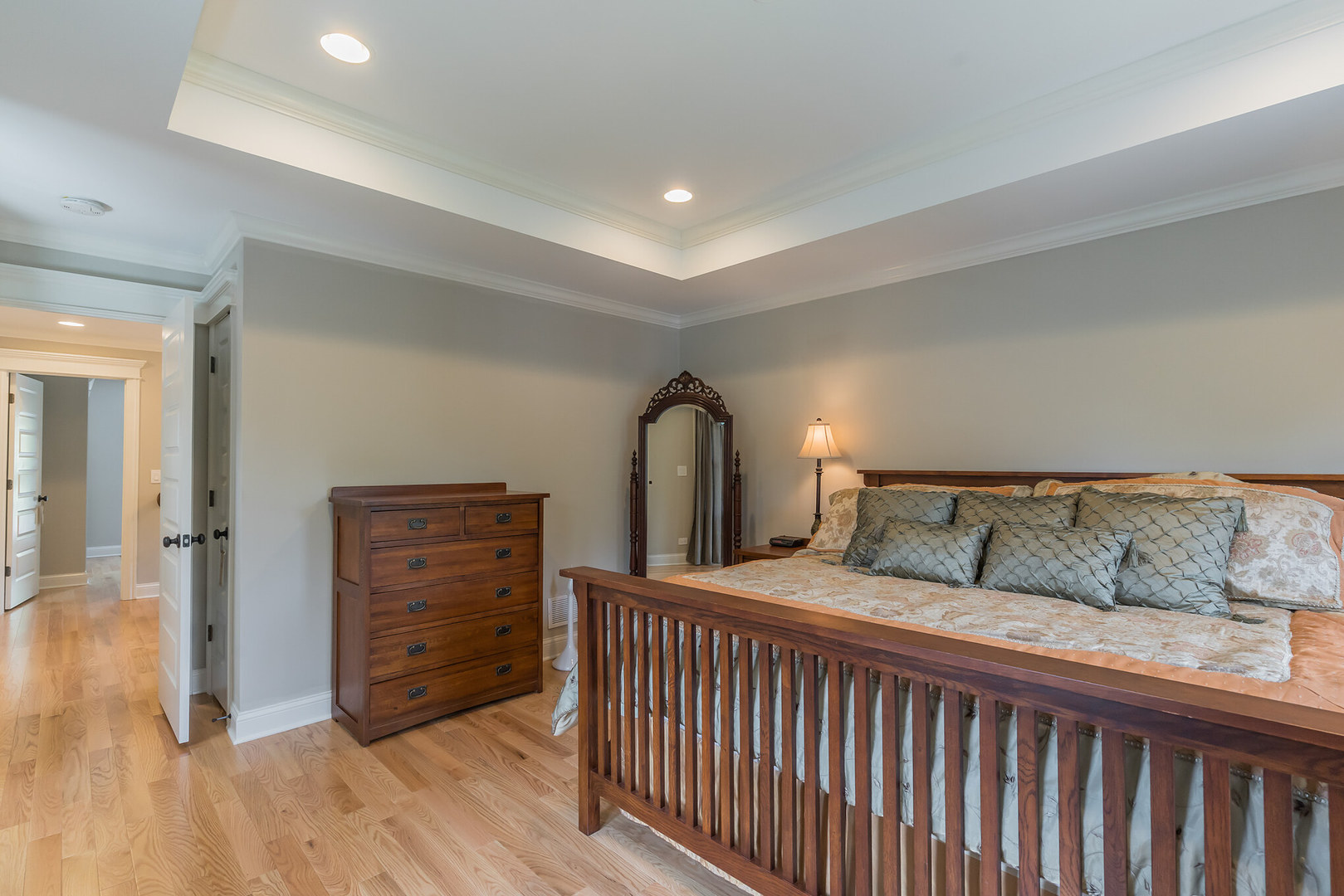 201 Spring Street Cary, IL 60013 - Photo 19 of 34 a bedroom with a bed and a mirror