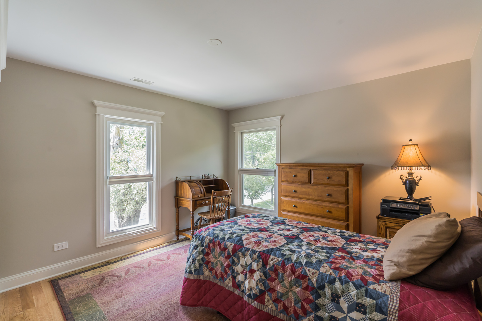 201 Spring Street Cary, IL 60013 - Photo 23 of 34 a bedroom with a bed and wooden floor