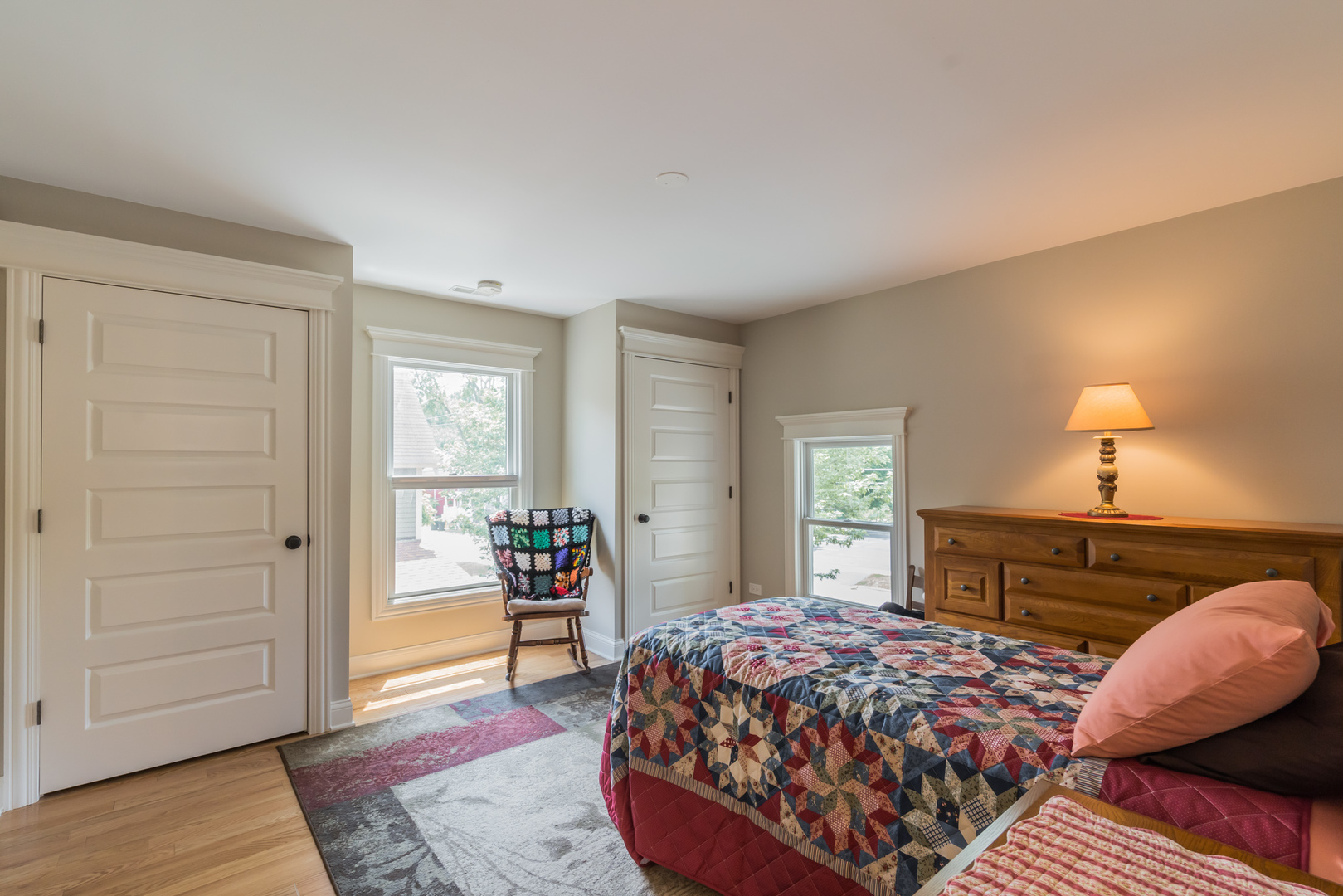 201 Spring Street Cary, IL 60013 - Photo 25 of 34 a bedroom with a bed and wooden floor