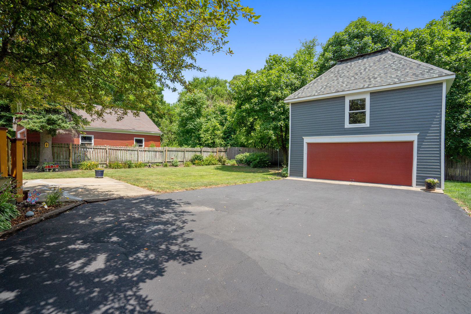 201 Spring Street Cary, IL 60013 - Photo 33 of 34 a front view of a house with a yard and garage