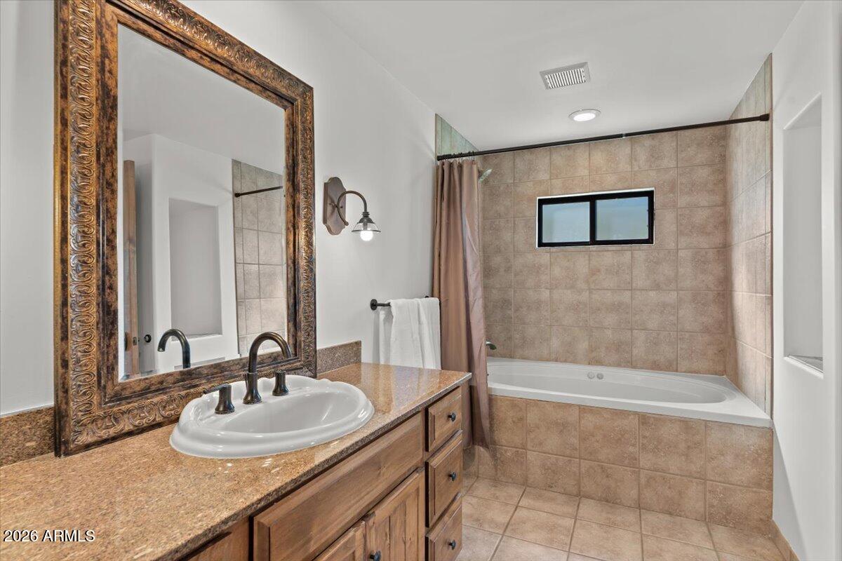 36601 North Mule Train Road, Unit C16 Carefree, AZ 85377 - Photo 16 of 38 a bathroom with a sink and a mirror