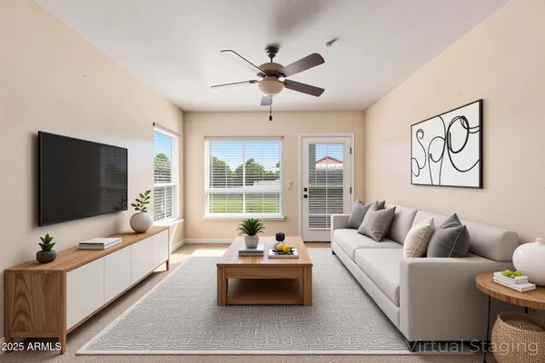 a living room with furniture and a flat screen tv