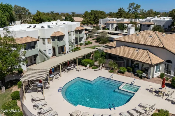an aerial view of a house with outdoor space