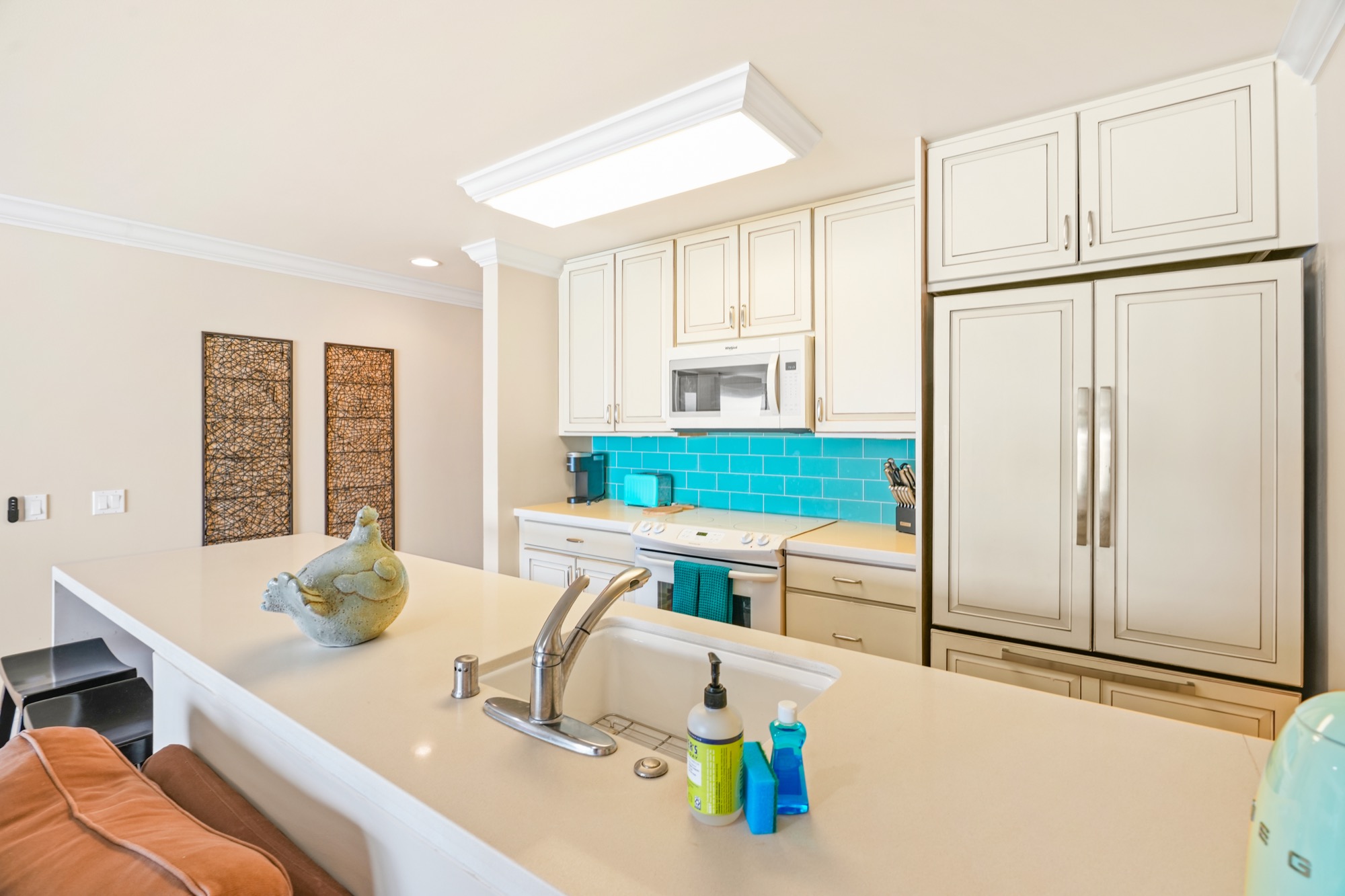 320 Papaloa Road, Unit 308 Kapaa, HI 96746 - Photo 11 of 26 a kitchen with stainless steel appliances granite countertop a sink and a refrigerator