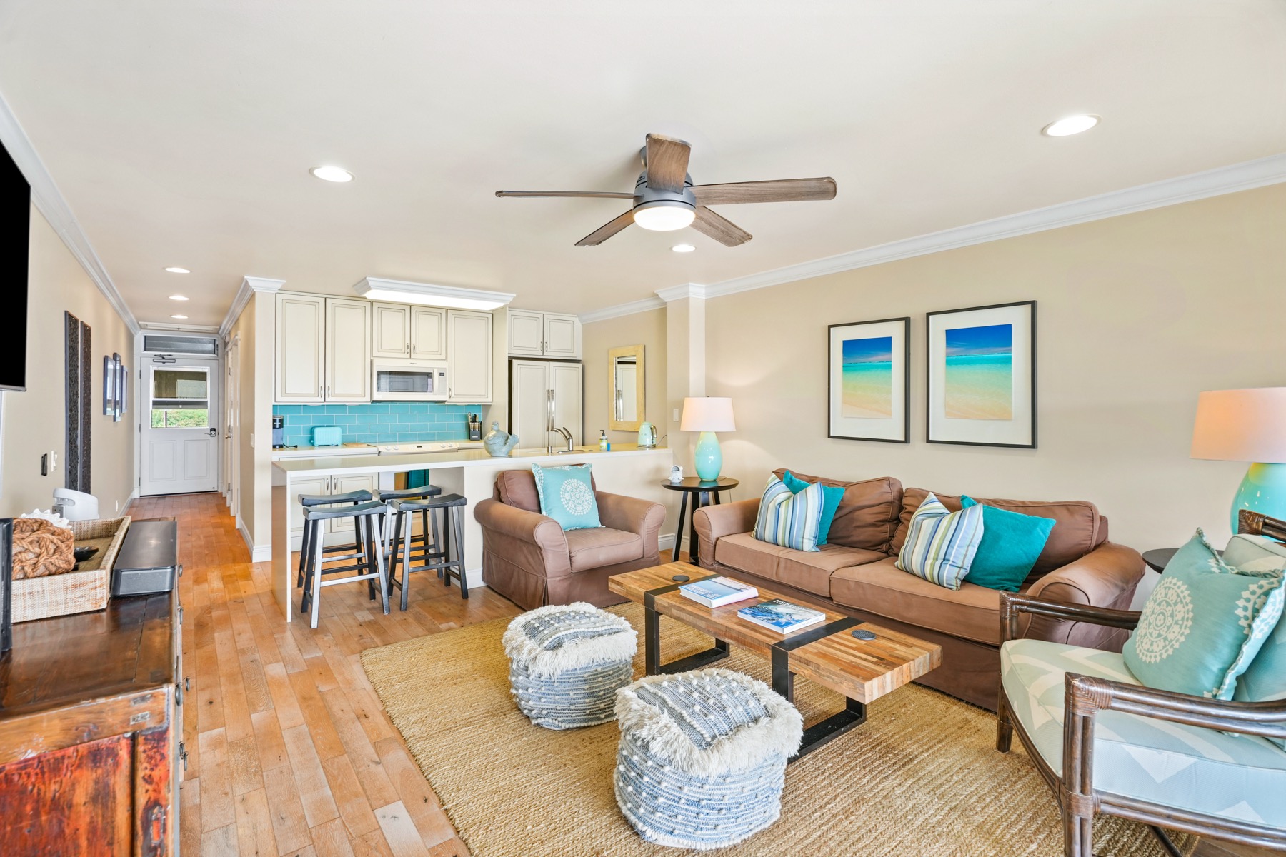 320 Papaloa Road, Unit 308 Kapaa, HI 96746 - Photo 7 of 26 a living room with furniture kitchen view and a wooden floor