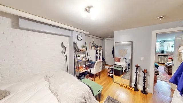 a view of a livingroom with furniture and workspace