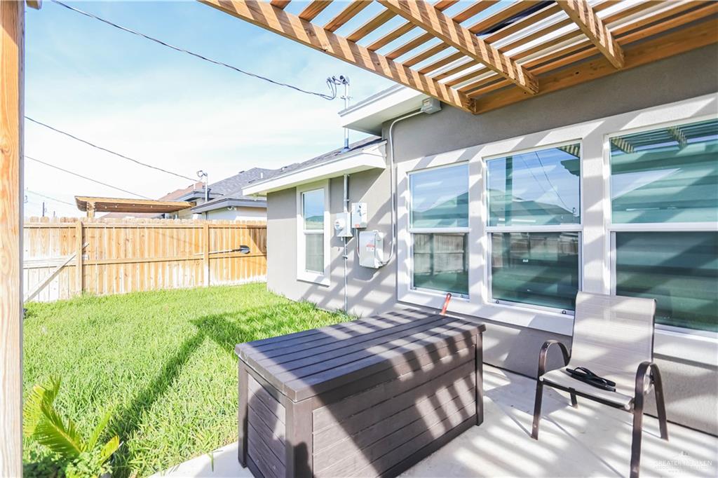 823 Whitewing Street Alamo, TX 78516 - Photo 15 of 15 a view of a patio with table and chairs and potted plants