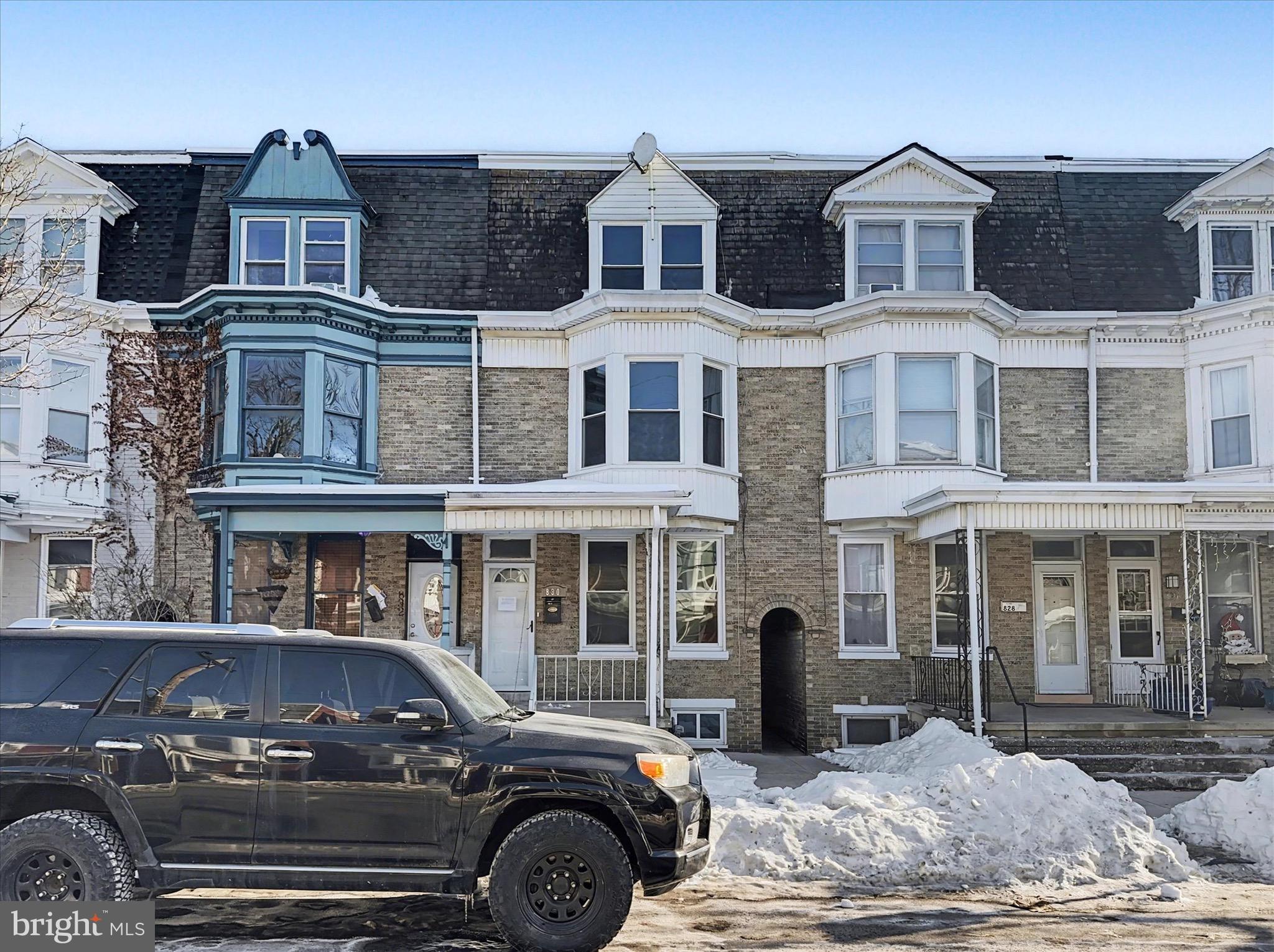 830 East Philadelphia Street York, PA 17403 - Photo 2 of 27 a front view of a residential apartment building with a yard