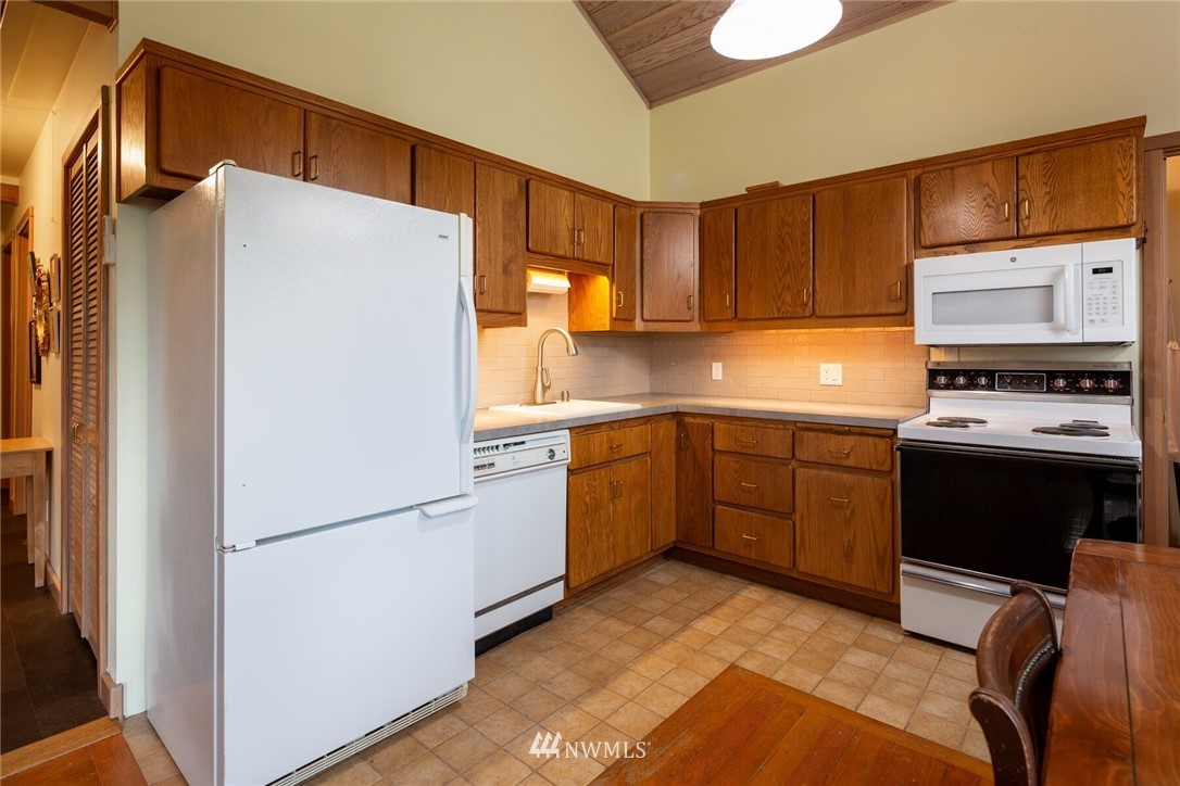 6481 Noon Road Everson, WA 98247 - Photo 14 of 25 a kitchen with a refrigerator sink and stove