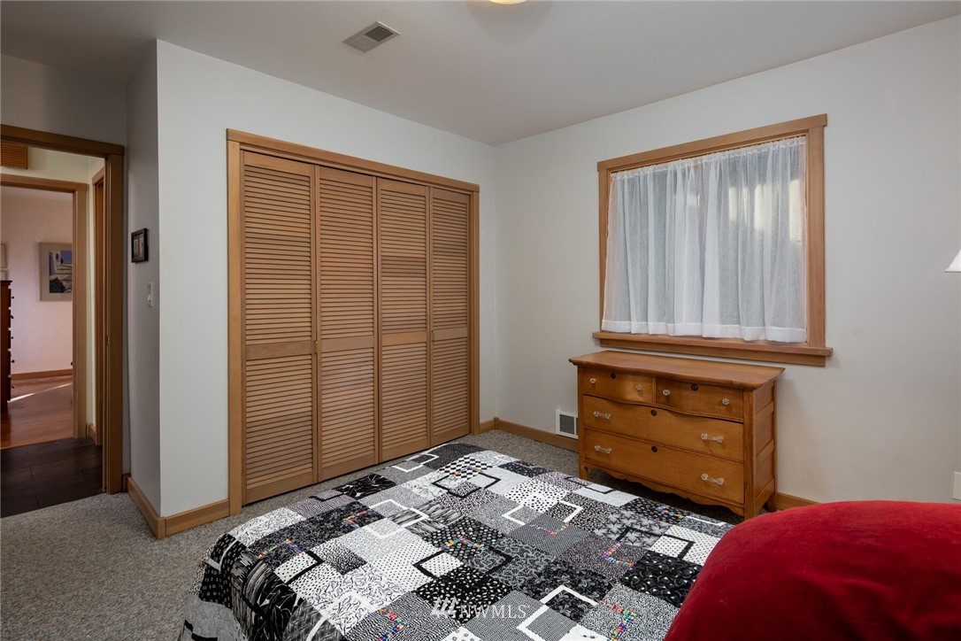 6481 Noon Road Everson, WA 98247 - Photo 17 of 25 a bedroom with a bed and a dresser