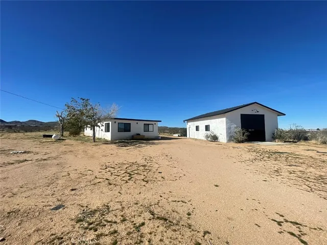 a view of a house with a snow in the yard