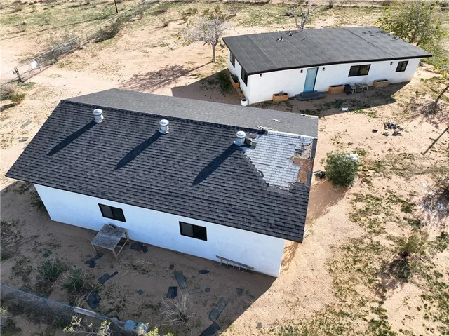 a aerial view of a house with a yard