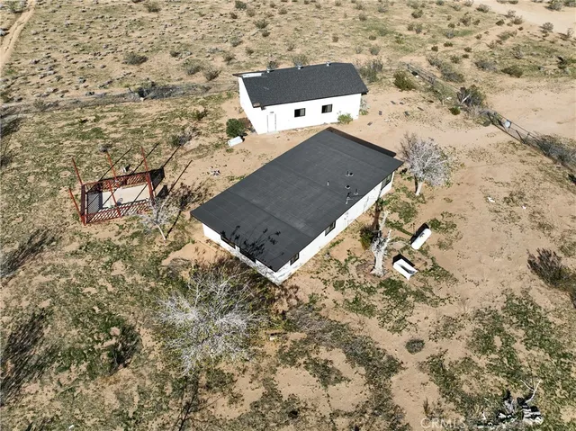 a backyard of a house with wooden fence
