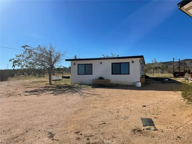 an aerial view of house with yard