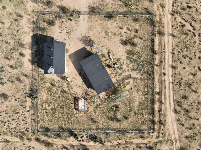 a aerial view of a house with a yard
