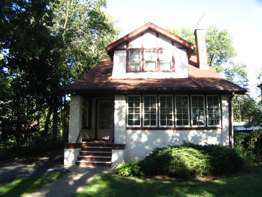 251 Bartram Road Riverside, IL 60546 - Photo 1 of 1 a front view of a house with garden