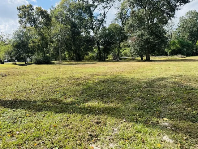 a view of outdoor space with swimming pool and green space