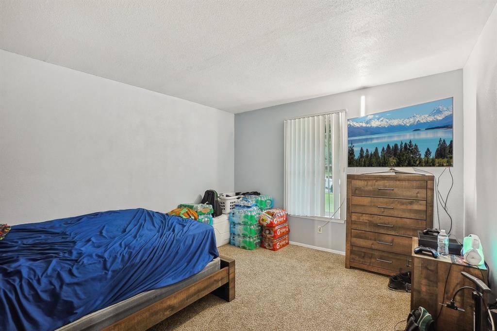 3601 Chime Street Irving, TX 75062 - Photo 11 of 17 a bedroom with furniture and a closet